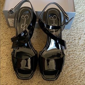 Black patent leather Jessica Simpson wedges.